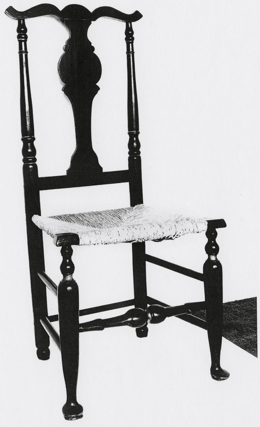 Black and white photograph of a fiddle-back side chair.