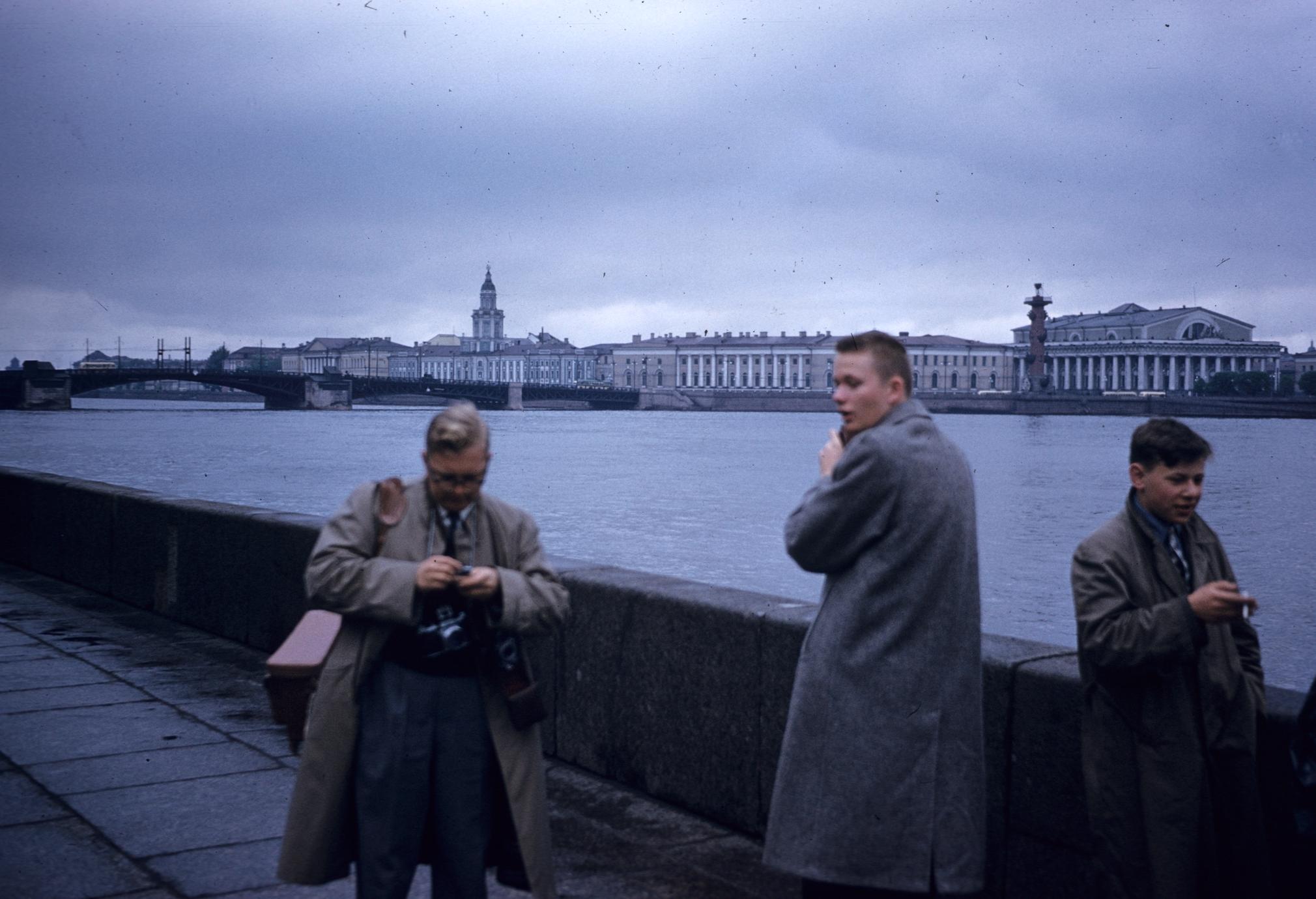 Men standing along the Neva River