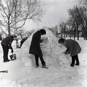 Students carving snow sculpture