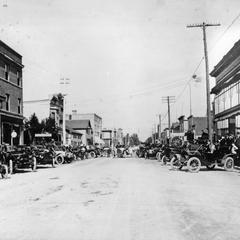 Automobiles congregate on main street in 1909