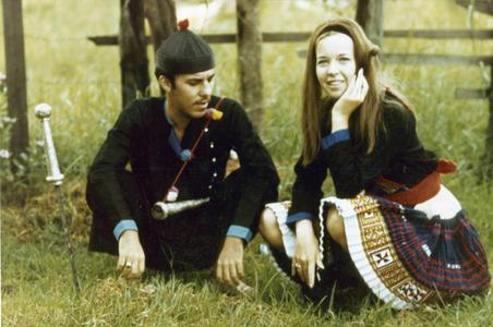Two Americans pose in Blue Hmong traditional dress in Pakxe in Sedone Province