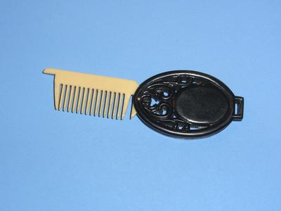 Miniature celluloid comb