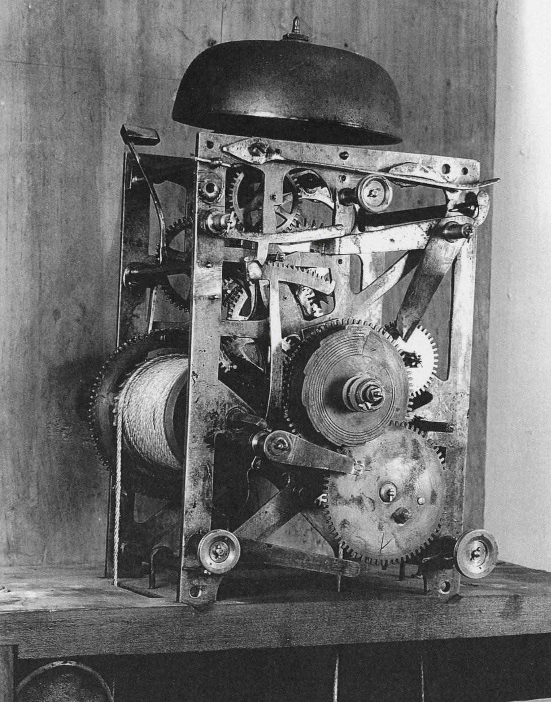 black and white photograph of eight-day, strike and repeater clock gear system.