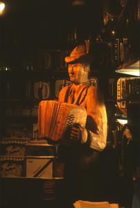 Wood sculpture of an accordion player