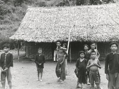Lanten villagers stand outside a school in Houa Khong Province