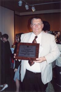 LaVerne Harrison with award, University of Wisconsin--Marshfield/Wood County, 2004