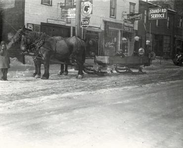 Horses hitched to sled on Main Street, Union Grove