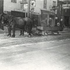 Horses hitched to sled on Main Street, Union Grove