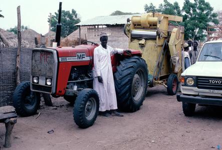 Tractor and Thresher Owned by a Village