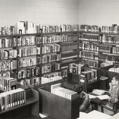 Tops of shelves and student corrals being used as emergency shelving, University of Wisconsin--Marshfield/Wood County, 1966-1967