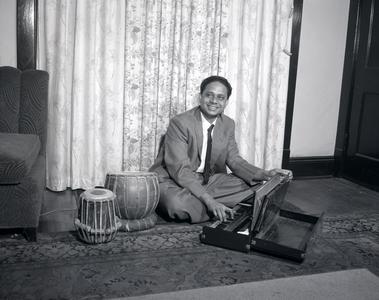 Indian student plays instrument