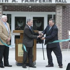 Ribbon cutting during the dedication of Keith A. Pamperin Hall