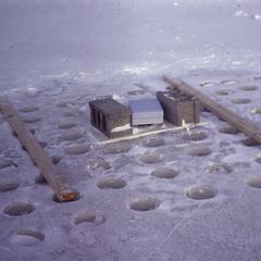 Holes drilled in ice for light