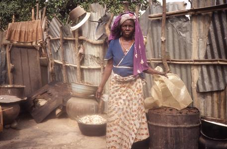 Woman processing dawadawa in a village near Abuja