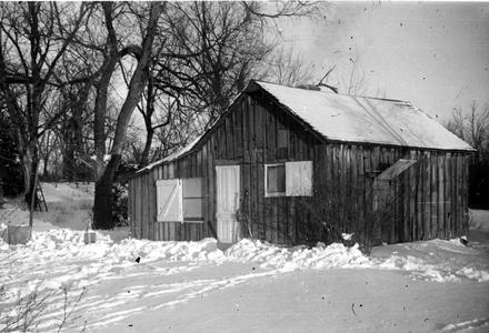Shack in winter from front