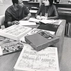Bolarinde Obebe and Marylee Wiley in the Instruction Materials Center
