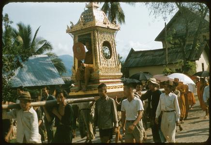 Carrying monk on palanquin