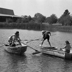 Students row on pond, UW Fond du Lac