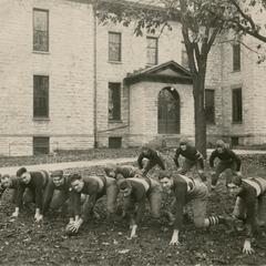 Offensive formation on front lawn of Wisconsin Mining School