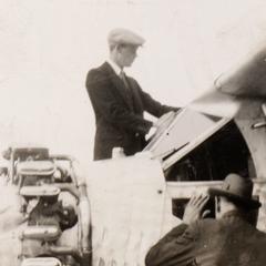 Lindbergh standing on plane