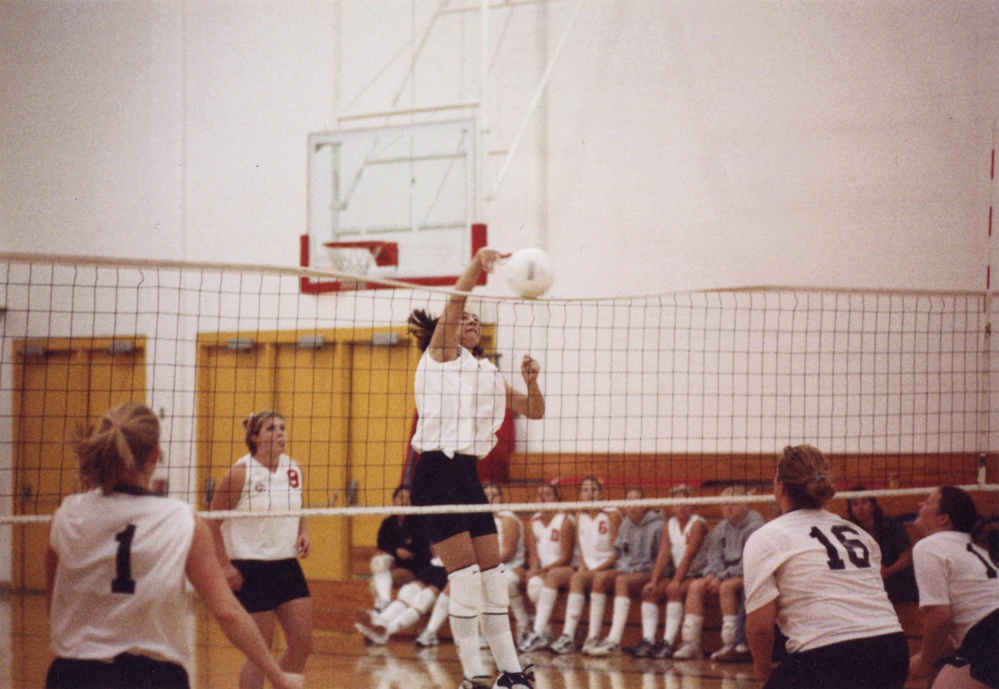 ‎Volleyball player spikes ball over net UWDC UWMadison Libraries