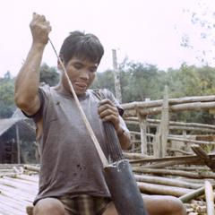 A Nyaheun man prepares to make bird traps in Attapu Province