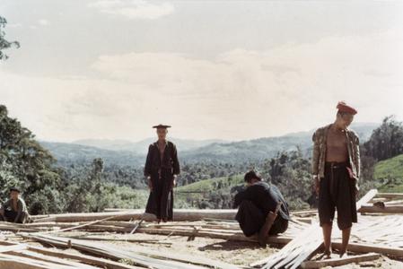 Akha men fabricate walls from bamboo at the village of Phate, Houa Khong Province