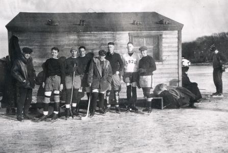 Hockey team by ice hut