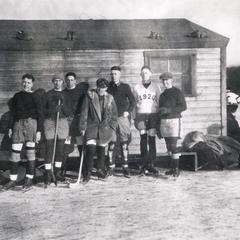 Hockey team by ice hut