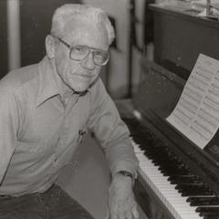 Music professor Peter Ayer at a piano