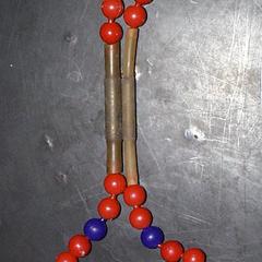 Pop beads modeling a chromosome with two chromatids