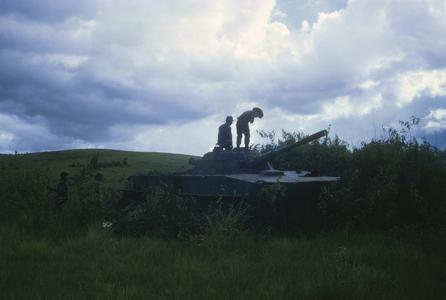 Inspecting Pathet Lao tank