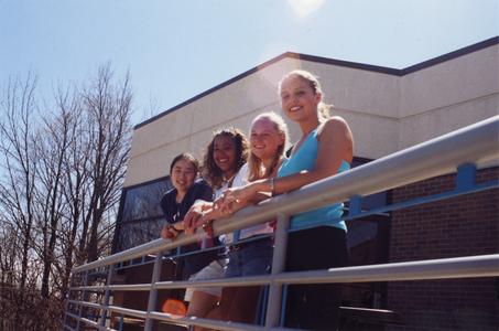 Students along railing outside cafeteria