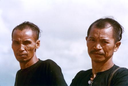 Two Lanten men pose near the village of Chommok in Houa Khong Province