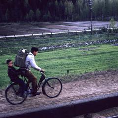 Man and child on bike