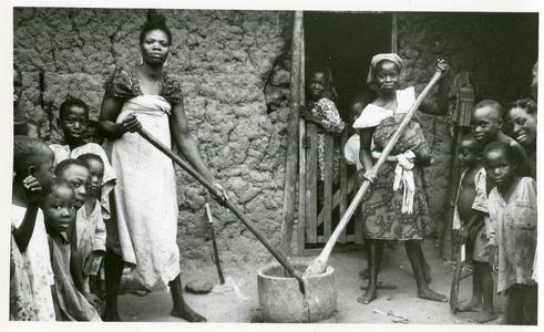 Women and children preparing food