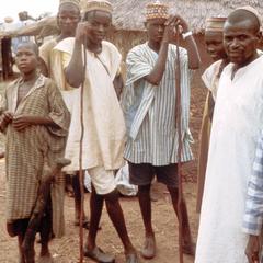 Fulbe Boys Leaning on Shepherds' Staffs in Village in Northern Nigeria