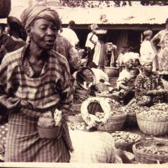 Woman with baskets of kola nuts