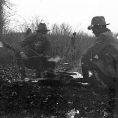 Aldo Leopold and Starker Leopold at campfire in Missouri