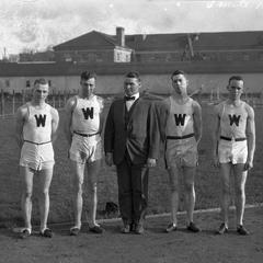 UW track team members and coach