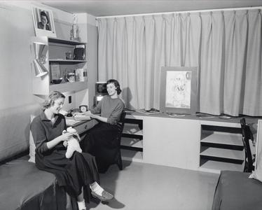 Women in mock-up dorm room