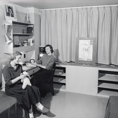 Women in mock-up dorm room