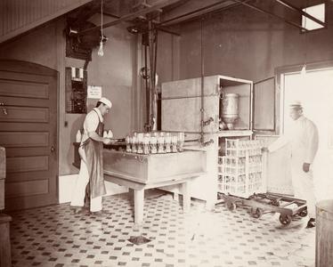Dairy School students sterilizing milk bottles