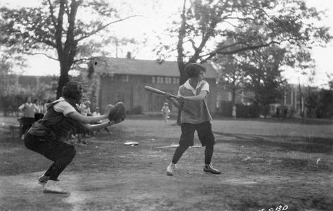 Woman batter in baseball game
