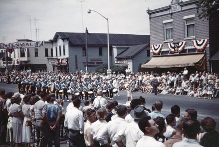 Centennial Parade in front of hardware store