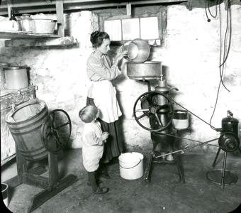 Woman using home dairy equipment
