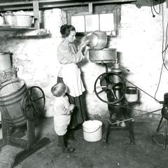 Woman using home dairy equipment