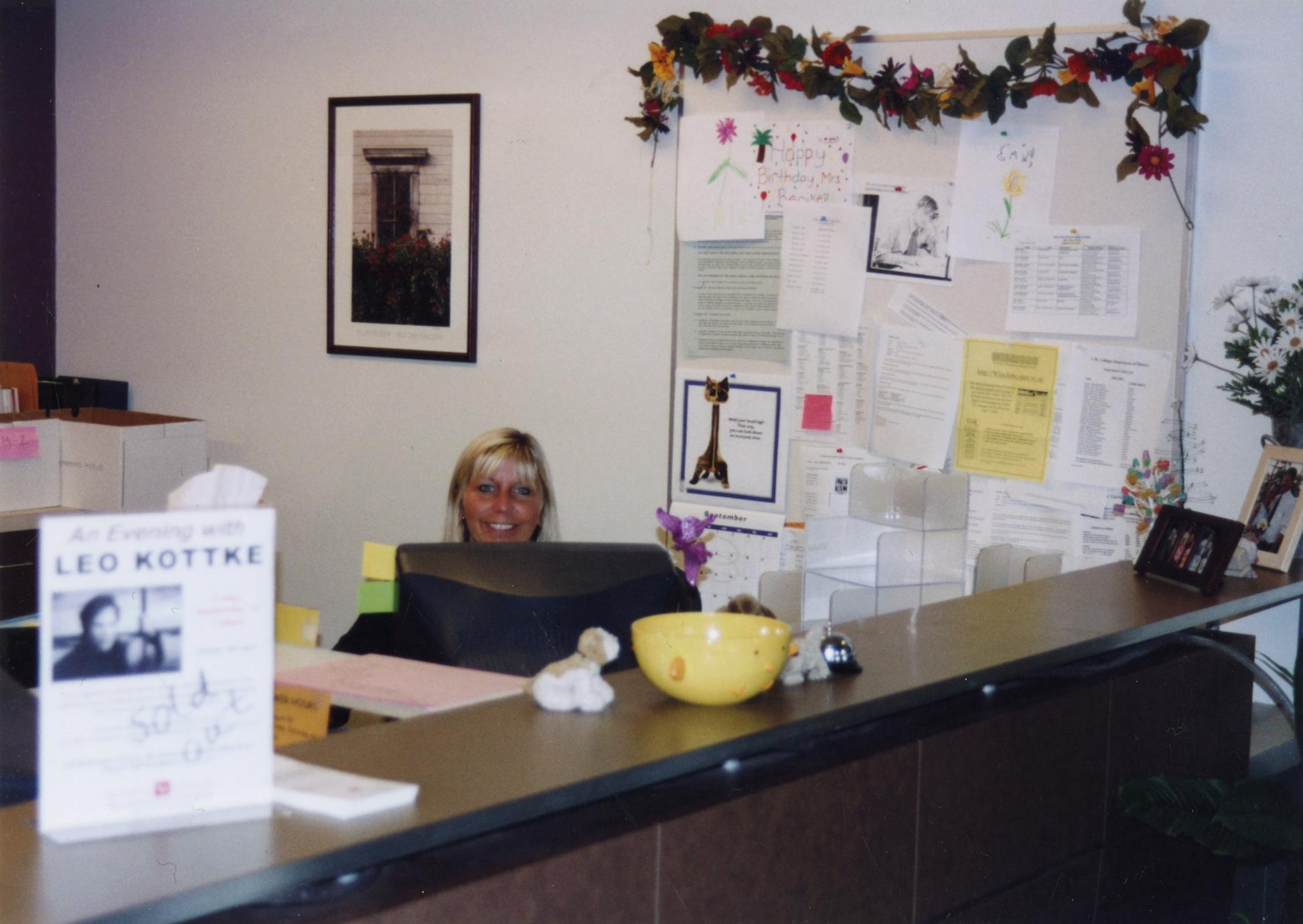 Administrative assistant Judy Benike at her desk