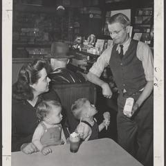A woman receives baby products during National Baby Week