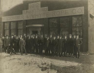 Employees in front of MacWhyte building